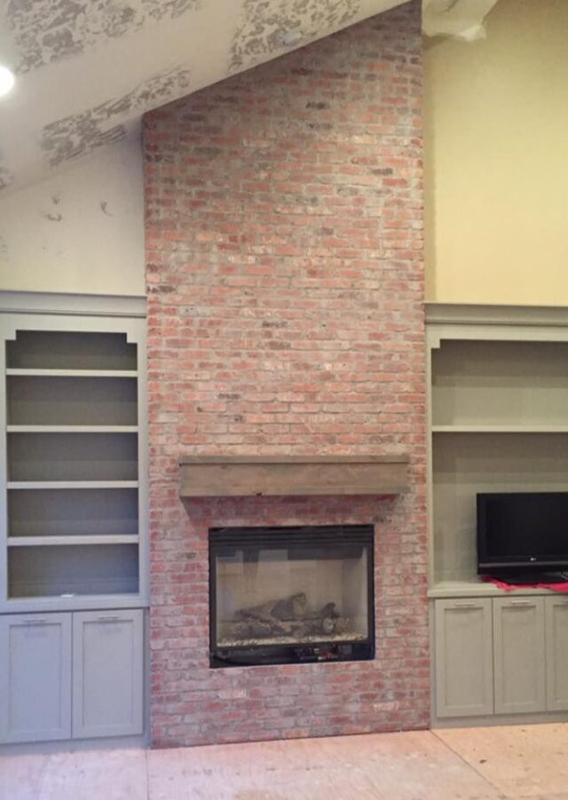 Exquisite brick fireplace with intricate detailing