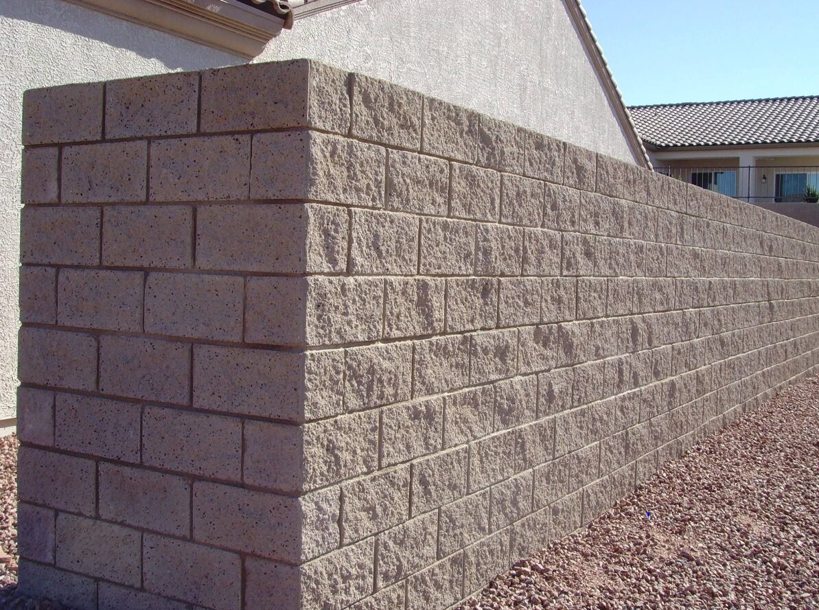 Retaining wall constructed with concrete blocks