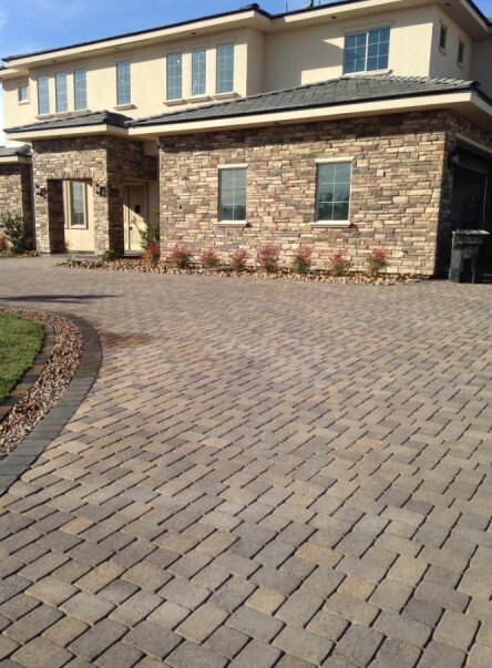 White and Brown House With Paver Installation