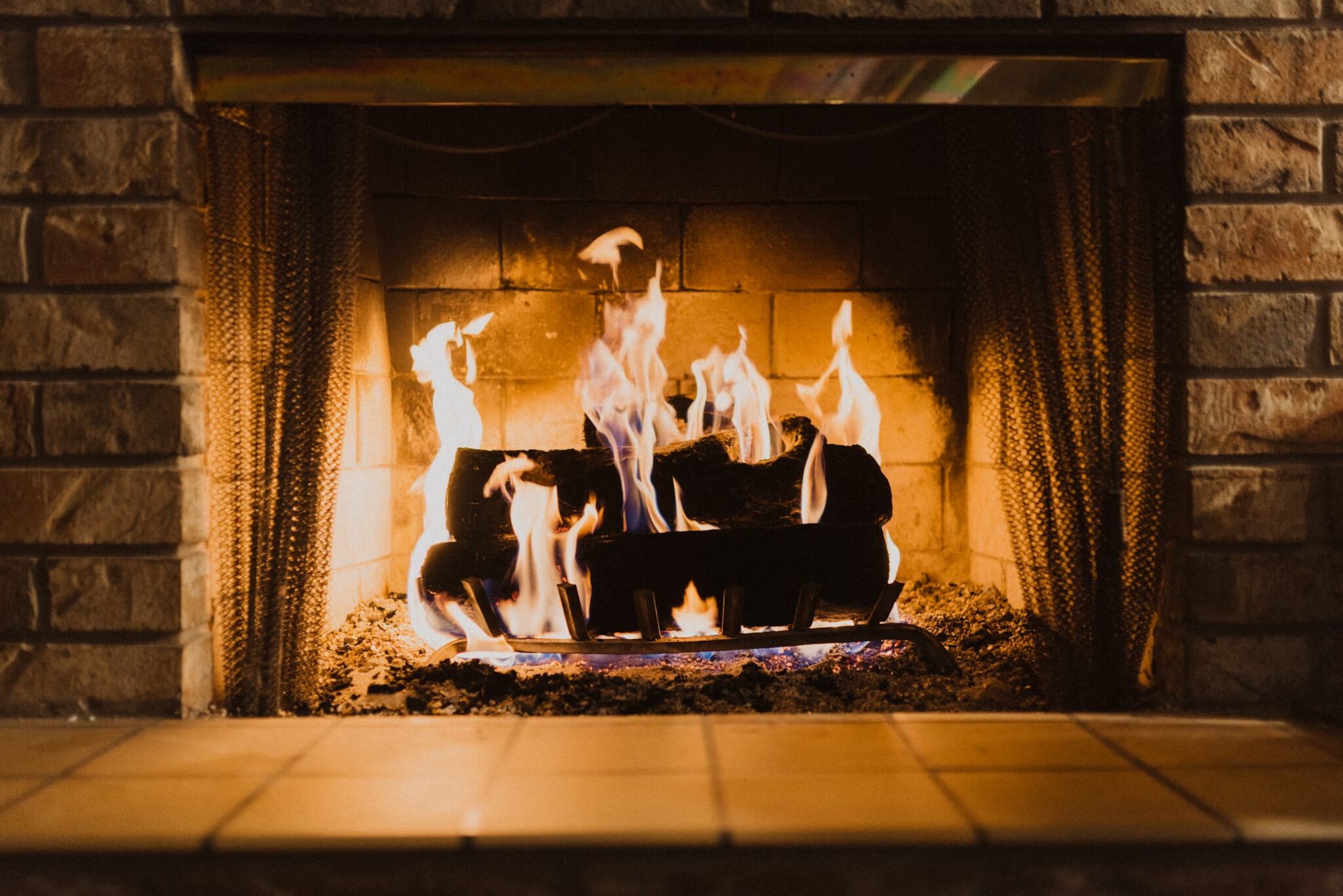 urning firewood in a fireplace, creating a warm and inviting ambiance.