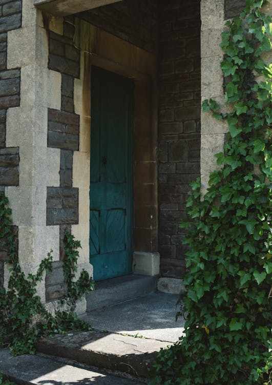 Custom-designed masonry entrance with accent lighting