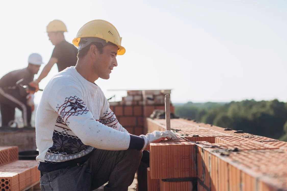 Masonry contractors at a construction site 