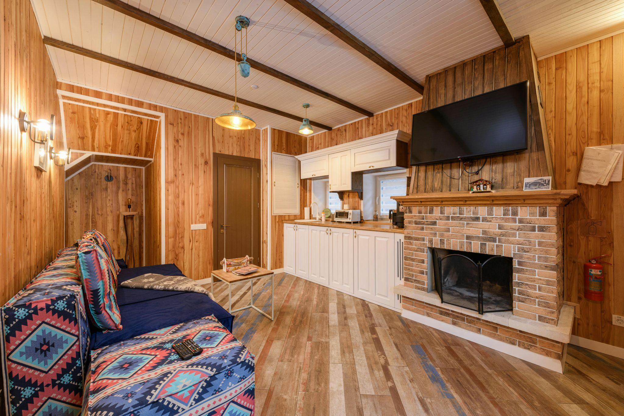 A cozy living room with a fireplace as the focal point