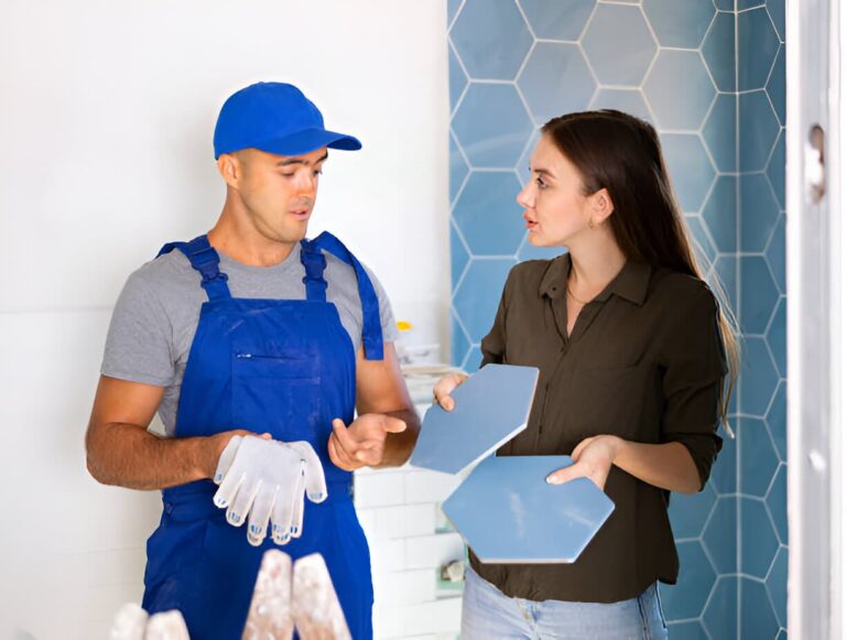 Homeowner discussing tile installation with contractor in Colorado Springs